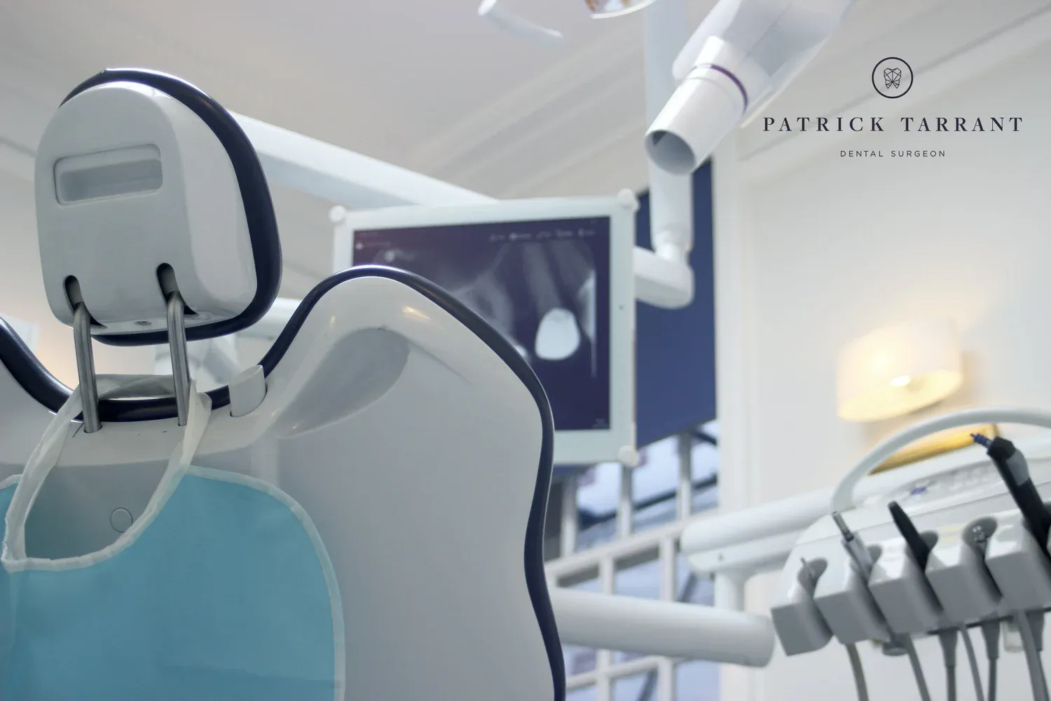 The dental chair, X-ray screen and overhead light in the surgery at 40 Harley Street